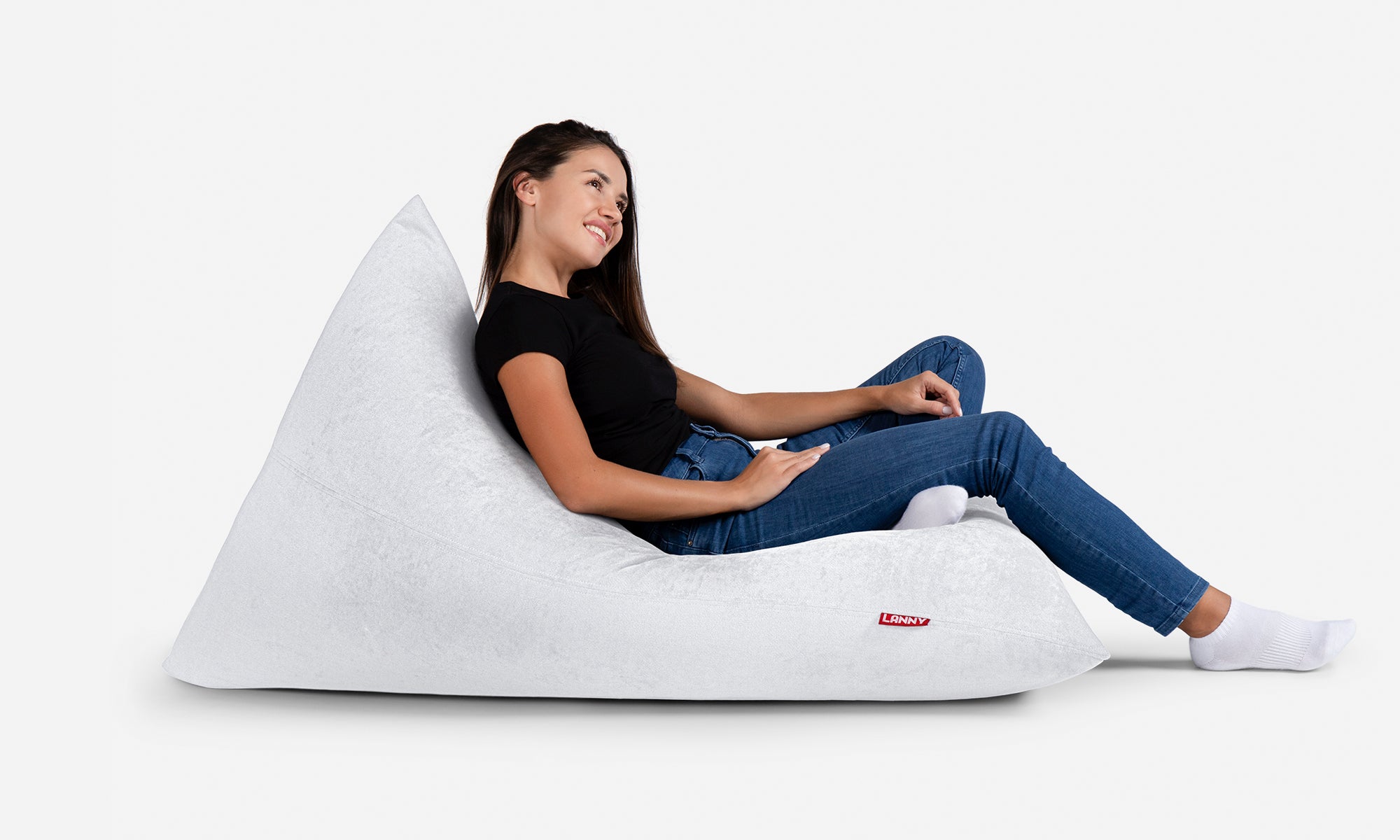 a woman seating on Lanny Slim white bean bag