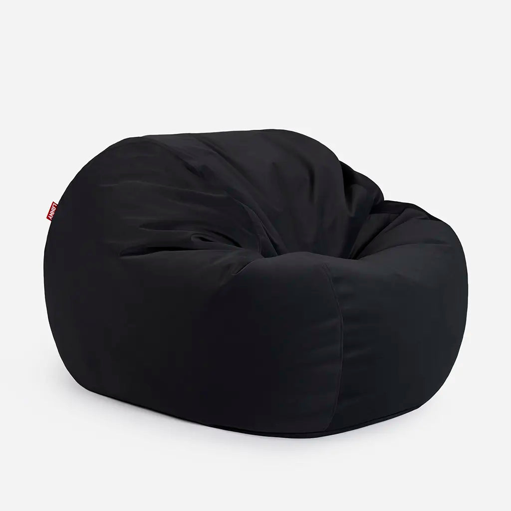 Side angle view of the Lanny Sphere black velvet bean bag, demonstrating its deep 140cm footprint and structured support for UAE seating