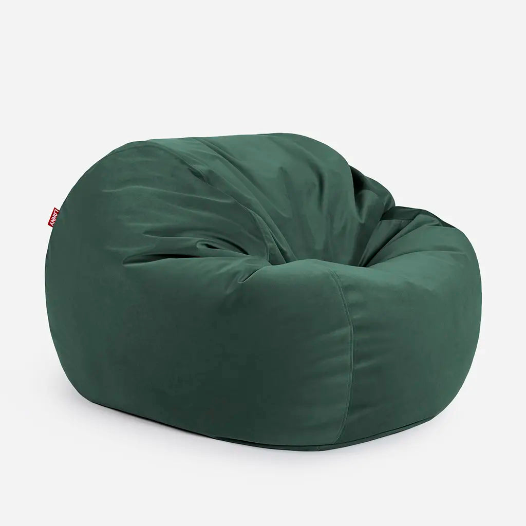 Side angle view of the Lanny Sphere green velvet bean bag, demonstrating its deep 140cm footprint and structured support for UAE seating