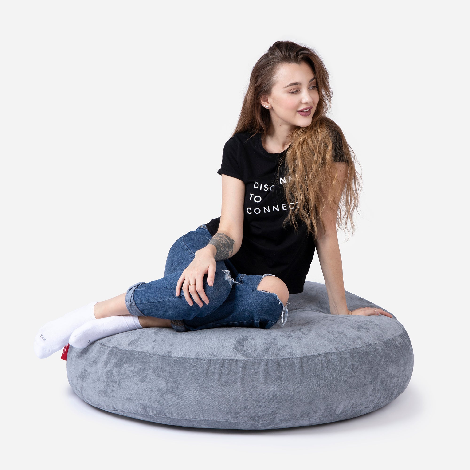 Pouf, Ottoman Gray color by Lanny with girl seating on it 