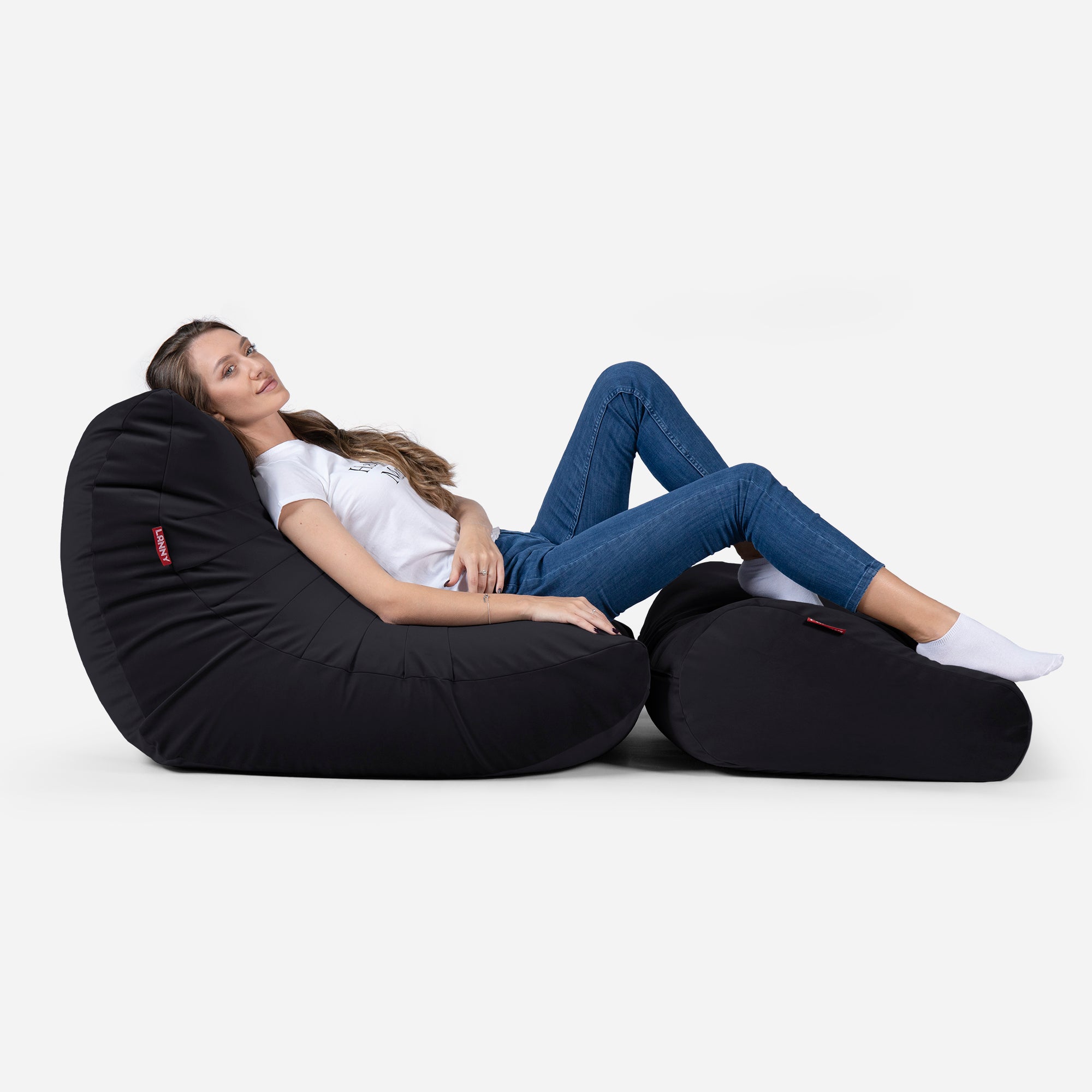 Beanbag Curvy Design Black color with girl seating on it 