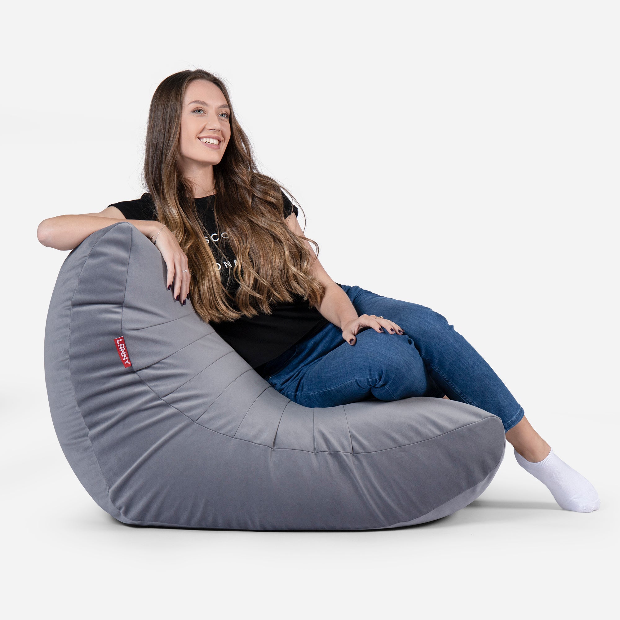 Beanbag Curvy Design Gray color with girl seating on it 