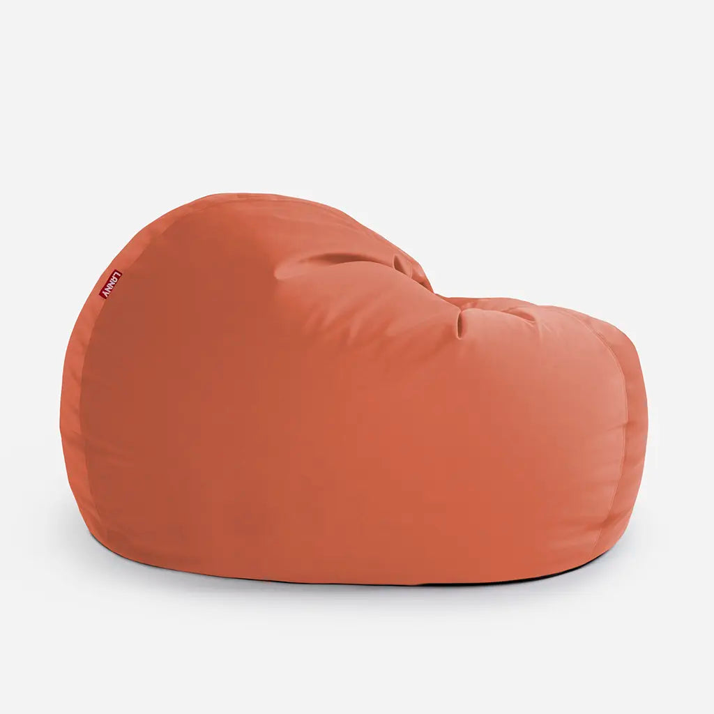 Lanny Sphere amber orange oversized seating for adults, showcasing the curved base and premium velvet fabric quality