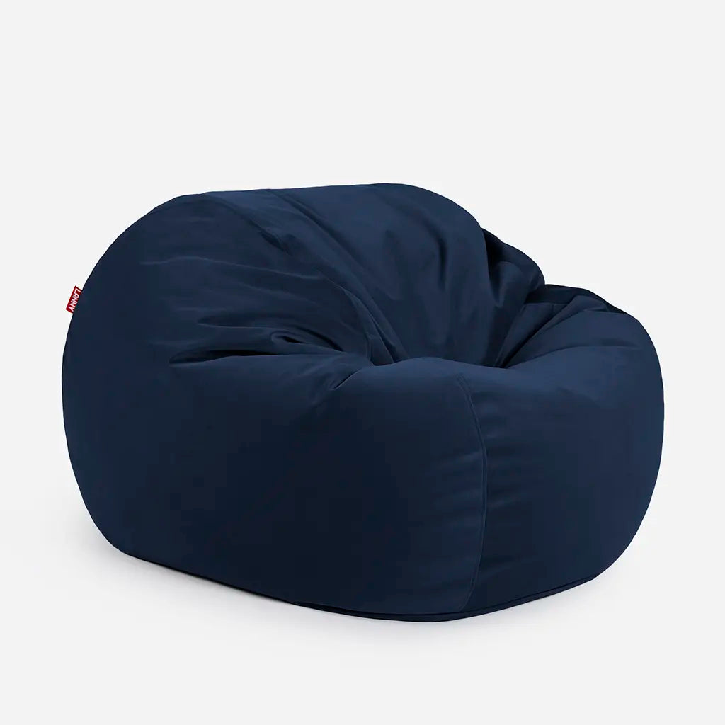 Side angle view of the Lanny Sphere blue velvet bean bag, demonstrating its deep 140cm footprint and structured support for UAE seating