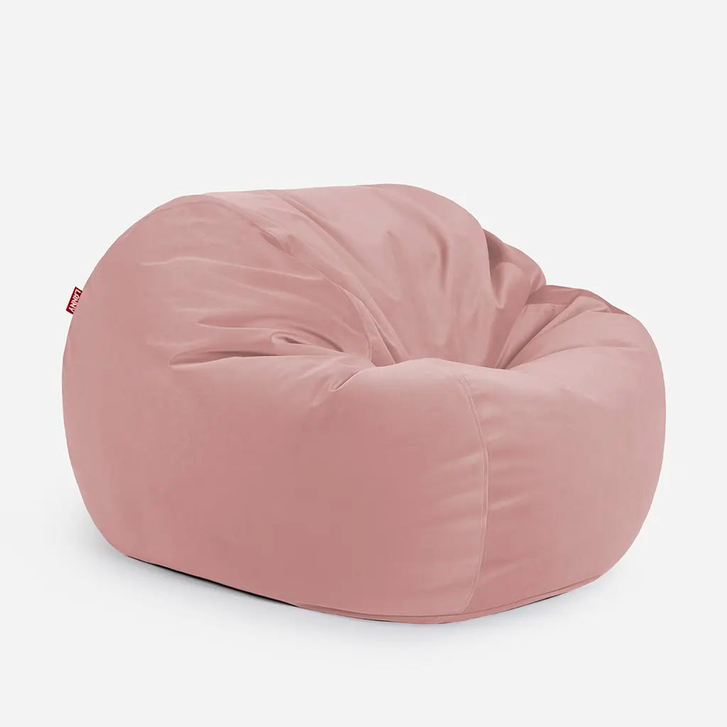 Side angle view of the Lanny Sphere pink velvet bean bag, demonstrating its deep 140cm footprint and structured support for UAE seating