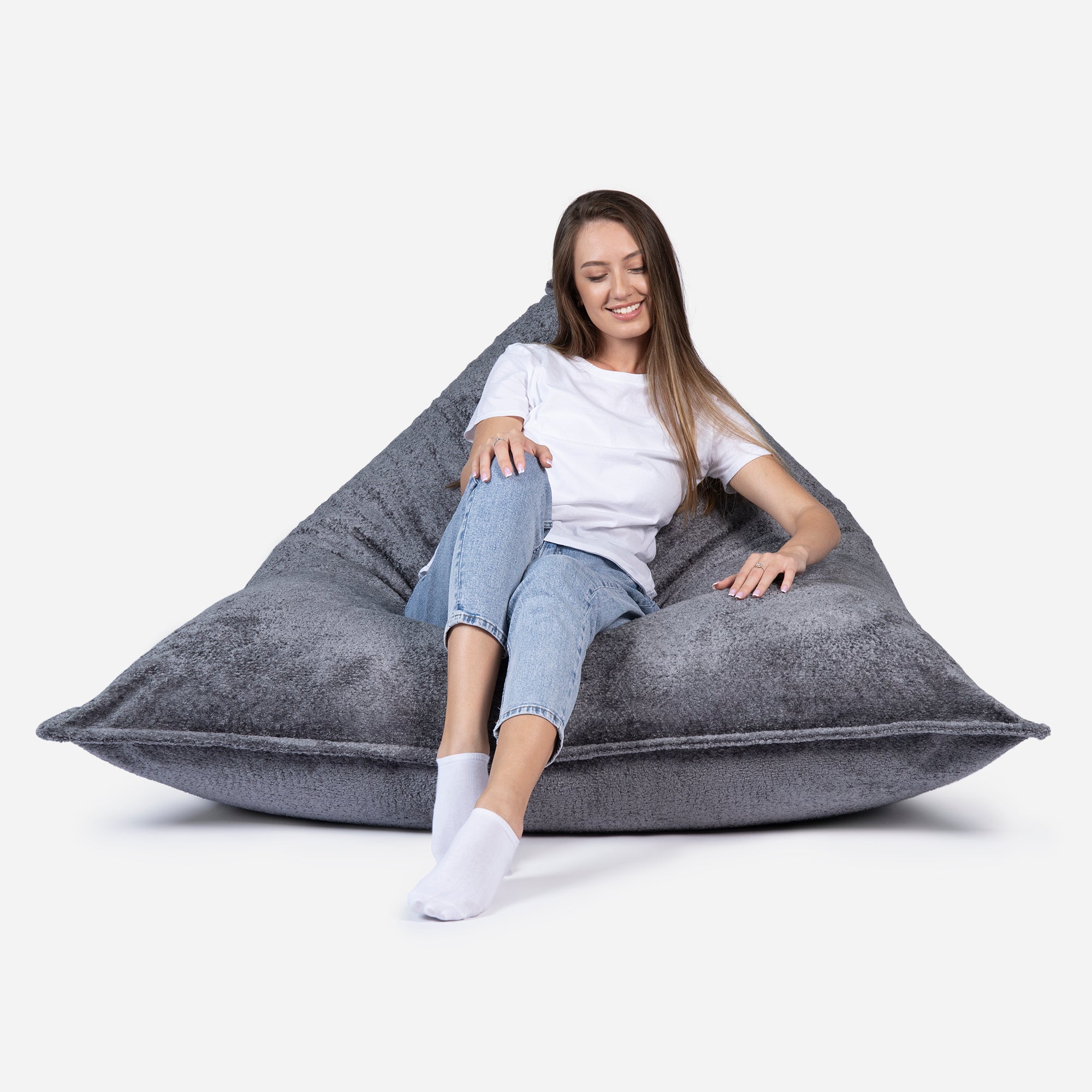 Beanbag Sloppy design fluffy fabric Dark Gray color  with girl seating on it 