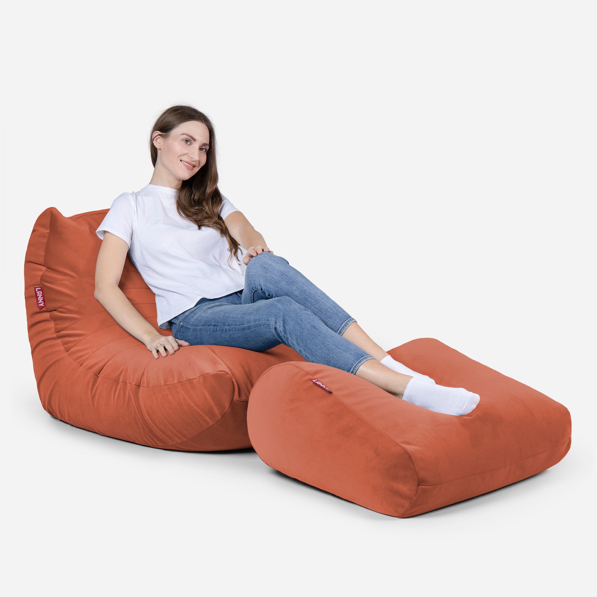 Beanbag Curvy Design Coral color with girl seating on it 
