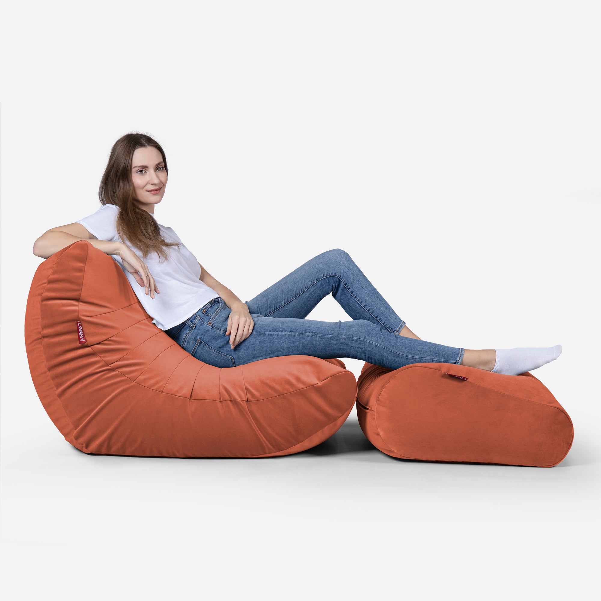 Beanbag Curvy Design Coral color with girl seating on it 